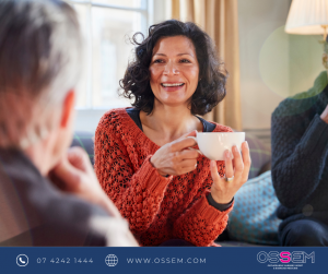 Woman smiling with cup of tea in hand